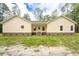 Charming yellow home with a covered front porch and well-maintained lawn at 480 Longleaf Dr, Walterboro, SC 29488