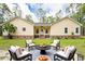 Charming yellow home with a well-maintained lawn and inviting outdoor seating area at 480 Longleaf Dr, Walterboro, SC 29488
