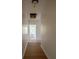 Hallway leads to rooms with windows providing natural light at 480 Longleaf Dr, Walterboro, SC 29488