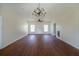 Spacious living room with hardwood floors, ceiling fan, modern lighting, and natural light at 480 Longleaf Dr, Walterboro, SC 29488