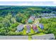 Picturesque neighborhood showcasing colorful homes with well-maintained lawns nestled among lush greenery and winding streets at 492 Sanders Farm Ln, Wando, SC 29492