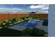 Backyard featuring a pool, lounge chairs and privacy fence at 492 Sanders Farm Ln, Wando, SC 29492