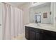 Well-lit bathroom featuring a vanity with ample storage and a shower/tub combo, offering convenience and comfort at 492 Sanders Farm Ln, Wando, SC 29492