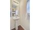 Charming half bathroom with a pedestal sink, decorative mirror, and stylish accents at 492 Sanders Farm Ln, Wando, SC 29492
