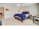 Bedroom featuring a bed with blue accents, a desk area, and neutral walls for a relaxing and inviting space at 492 Sanders Farm Ln, Wando, SC 29492