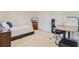 Comfortable bedroom with a bed, a desk with an office chair, and plenty of natural light for a productive space at 492 Sanders Farm Ln, Wando, SC 29492
