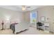 Bright bedroom featuring a white bed frame, ceiling fan, and desk area, perfect for a or teen at 492 Sanders Farm Ln, Wando, SC 29492