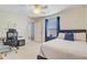 Bedroom with a bed, adjacent desk, and neutral decor for a calm and inviting atmosphere at 492 Sanders Farm Ln, Wando, SC 29492