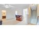 Bonus room with carpet flooring, ceiling fan, and access to the upper level rooms at 492 Sanders Farm Ln, Wando, SC 29492