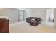 Relaxing bonus room with a comfortable couch and plenty of natural light, great for entertaining or relaxing at 492 Sanders Farm Ln, Wando, SC 29492