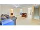 Bonus room with carpet flooring, comfortable sofa, and staircase leading to the lower level at 492 Sanders Farm Ln, Wando, SC 29492