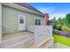 Wooden deck with white railings, adjacent to the house with backyard views at 492 Sanders Farm Ln, Wando, SC 29492