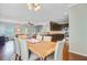 Open dining area connecting the kitchen and living room, perfect for entertaining guests at 492 Sanders Farm Ln, Wando, SC 29492