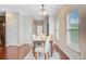 Bright dining room featuring a wooden table with seating and hardwood floors at 492 Sanders Farm Ln, Wando, SC 29492