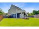 Back of home featuring a deck, outdoor stairs, and a spacious backyard at 492 Sanders Farm Ln, Wando, SC 29492