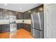 Well-equipped kitchen with stainless appliances, dark cabinets, and ample counter space at 492 Sanders Farm Ln, Wando, SC 29492