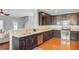 Beautiful kitchen with stainless steel appliances, dark cabinets, and hardwood flooring at 492 Sanders Farm Ln, Wando, SC 29492