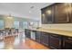 Open-concept kitchen and dining area featuring hardwood floors and modern appliances at 492 Sanders Farm Ln, Wando, SC 29492