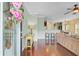 Spacious living room with wood floors, a ceiling fan, and an open layout, perfect for entertaining at 492 Sanders Farm Ln, Wando, SC 29492
