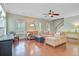 Spacious living room showcasing hardwood floors, a ceiling fan, and comfortable seating at 492 Sanders Farm Ln, Wando, SC 29492