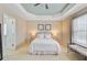 View of a spacious main bedroom with a king bed, walk in closet and ensuite bathroom at 492 Sanders Farm Ln, Wando, SC 29492