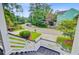 Scenic street view from the front porch, showcasing lush greenery and neighboring homes at 492 Sanders Farm Ln, Wando, SC 29492