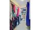 Bright walk-in closet features built-in shelving, hanging racks, and carpet flooring at 492 Sanders Farm Ln, Wando, SC 29492