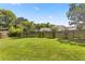 Large, grassy backyard enclosed by a wooden fence, offering a private outdoor space at 504 Dolphin Dr, Summerville, SC 29485