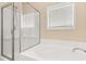 The bathroom offers a separate shower and tub under a bright window at 504 Dolphin Dr, Summerville, SC 29485