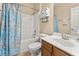 Bright bathroom with a shower-tub combo, white vanity, and updated fixtures at 504 Dolphin Dr, Summerville, SC 29485