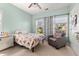 Cozy bedroom featuring natural light, neutral color palette, and comfortable furnishings at 504 Dolphin Dr, Summerville, SC 29485