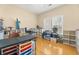 Bright bedroom with hardwood floors, large windows, and open shelving at 504 Dolphin Dr, Summerville, SC 29485