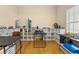 Bright bedroom with hardwood floors, large windows, and white open shelving at 504 Dolphin Dr, Summerville, SC 29485