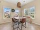 Cozy dining area with natural lighting, a rustic table, and neutral walls at 504 Dolphin Dr, Summerville, SC 29485