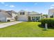 Charming yellow two-story home with a well-manicured lawn, attached garage, and welcoming front porch at 504 Dolphin Dr, Summerville, SC 29485