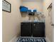 Functional laundry room with washer, dryer, and ample storage space on the shelves at 504 Dolphin Dr, Summerville, SC 29485