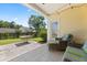 Covered patio with backyard view, featuring comfortable seating and a well-maintained lawn at 504 Dolphin Dr, Summerville, SC 29485