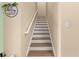 A staircase with hardwood treads and white risers leads upstairs at 504 Dolphin Dr, Summerville, SC 29485