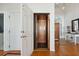 Home interior features a wooden elevator with tiled floor, and an entrance view to the main foyer at 505 E Arctic Ave, Folly Beach, SC 29439