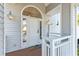 Inviting entryway with a white door and decorative lanterns at 505 E Arctic Ave, Folly Beach, SC 29439