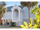 Charming beach home with elevated construction and lush lawn at 505 E Arctic Ave, Folly Beach, SC 29439