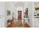 Welcoming foyer with wood floors, high ceilings and decorative accents at 505 E Arctic Ave, Folly Beach, SC 29439