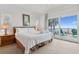 Cozy main bedroom with access to a private balcony offering stunning ocean views at 505 E Arctic Ave, Folly Beach, SC 29439