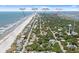 Aerial view highlighting the proximity of a beachfront home to local dining and the pier at 509 E Ashley Ave, Folly Beach, SC 29439