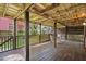 Spacious back porch with a wooden deck and a view of the lush backyard at 509 E Ashley Ave, Folly Beach, SC 29439