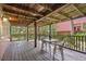 Comfortable covered back porch providing ample seating and outdoor views at 509 E Ashley Ave, Folly Beach, SC 29439