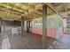 Charming covered back porch with seating and a view of the outdoors at 509 E Ashley Ave, Folly Beach, SC 29439