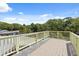 Large balcony with railing overlooking greenery and neighborhood at 509 E Ashley Ave, Folly Beach, SC 29439