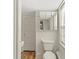 Bathroom area featuring a toilet, vanity, and window with natural light at 509 E Ashley Ave, Folly Beach, SC 29439