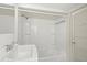 Clean bathroom featuring a sink, tub, shower, and neutral finishes at 509 E Ashley Ave, Folly Beach, SC 29439